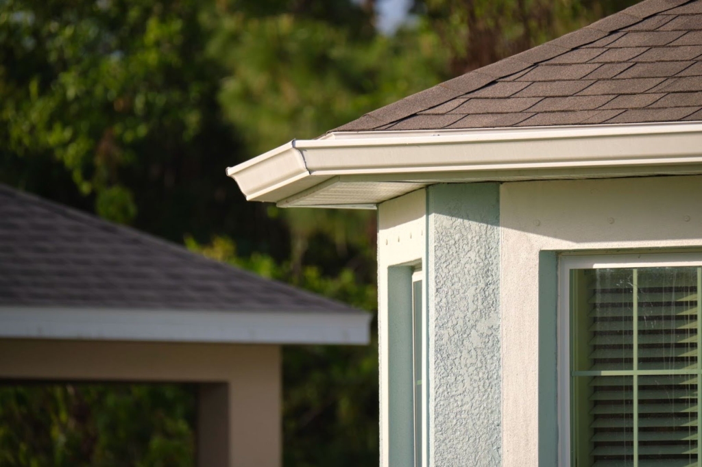 Gutters and windows on the outside of a home.